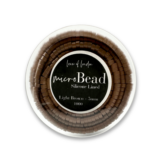 pre-loaded micro beads. Specifically designed for weft and I-tip hair extensions, these beads feature a silicone lining that ensures a secure and comfortable grip without damaging your natural hair. The pre-loaded design allows for a fast and efficient set-up, enabling quicker loading on your looping tool. 