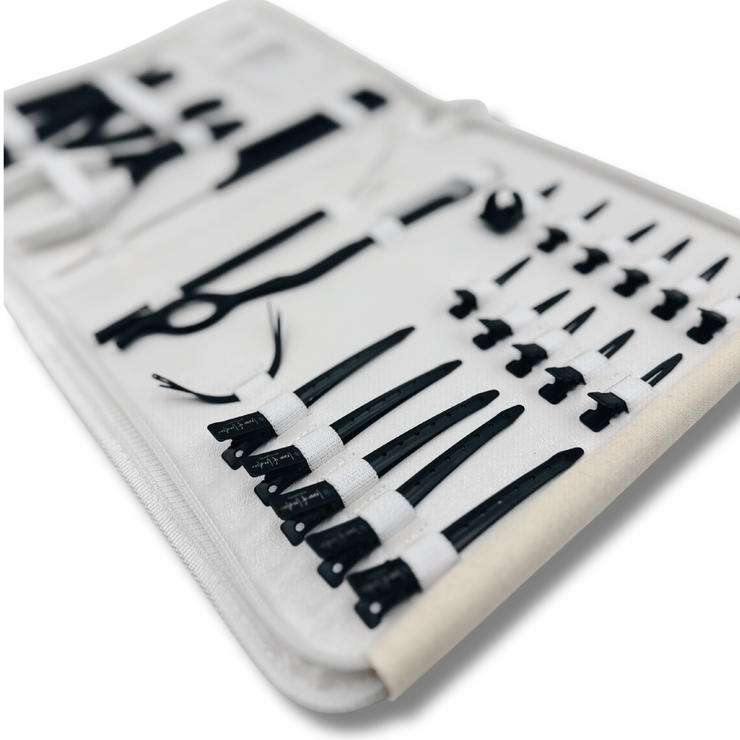 Professional Hair Extensions Kit with bead opener, pin tail comb, razor, 3 needles, threader (plus extra loop), 10 small section clips, 5 medium sectioning clips, grippers, sectioning ring, pliers, and bond cutter. Complete hair extension tools set for efficient and precise hair extension application. Ideal for hair stylists and salons