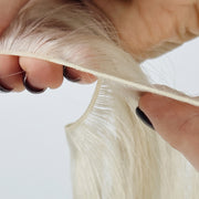 Close-up view of Genius Miracle Micro W wefts, the smallest wefts on the market. These delicate wefts ensure a seamless and natural integration with your hair, providing ultimate comfort and durability